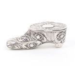 A 19th Century silver filigree box modelled in the form of a shoe, the hinged cover with vacant