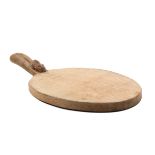 A ‘Mouseman’ Thompson oval oak bread board the handle carved with a mouse, 37cm.