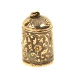 A good 19th Century Armenian niello decorated thimble, with flowerhead recesses and scrolling leaf