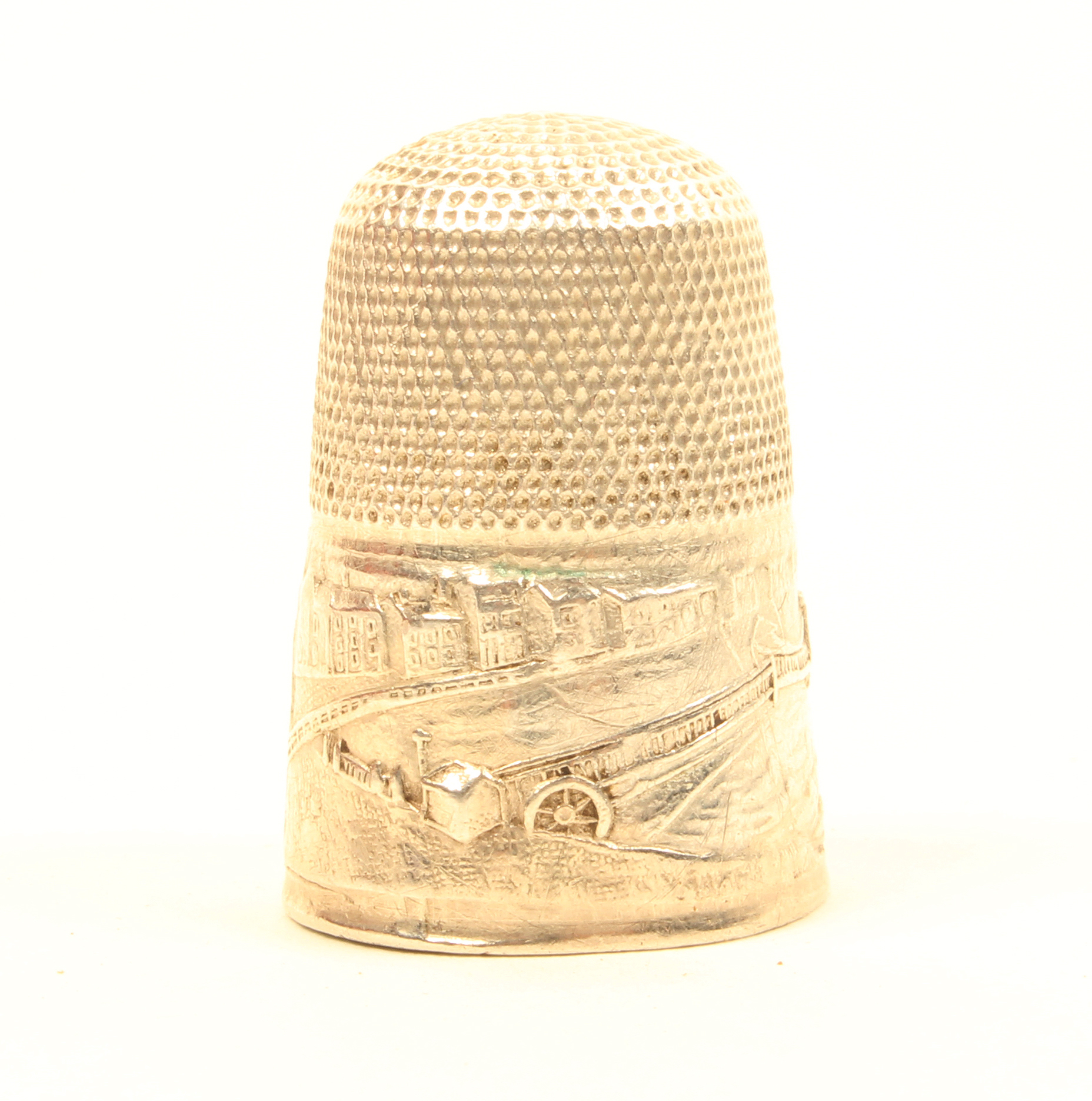 A mid 19th Century silver souvenir thimble depicting the Brighton Chain Pier and Parade.