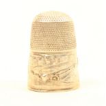 A mid 19th Century silver souvenir thimble depicting the Brighton Chain Pier and Parade.