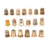 Nineteen English silver thimbles, mostly hall marked including five with stone tops and one in