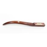An elegant 19th Century mahogany knitting stick of square section, curved and tapering, inlaid in