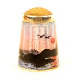 A Norwegian silver and enamel stone top thimble by Aksel Holmsen, depicting a figure in a boat