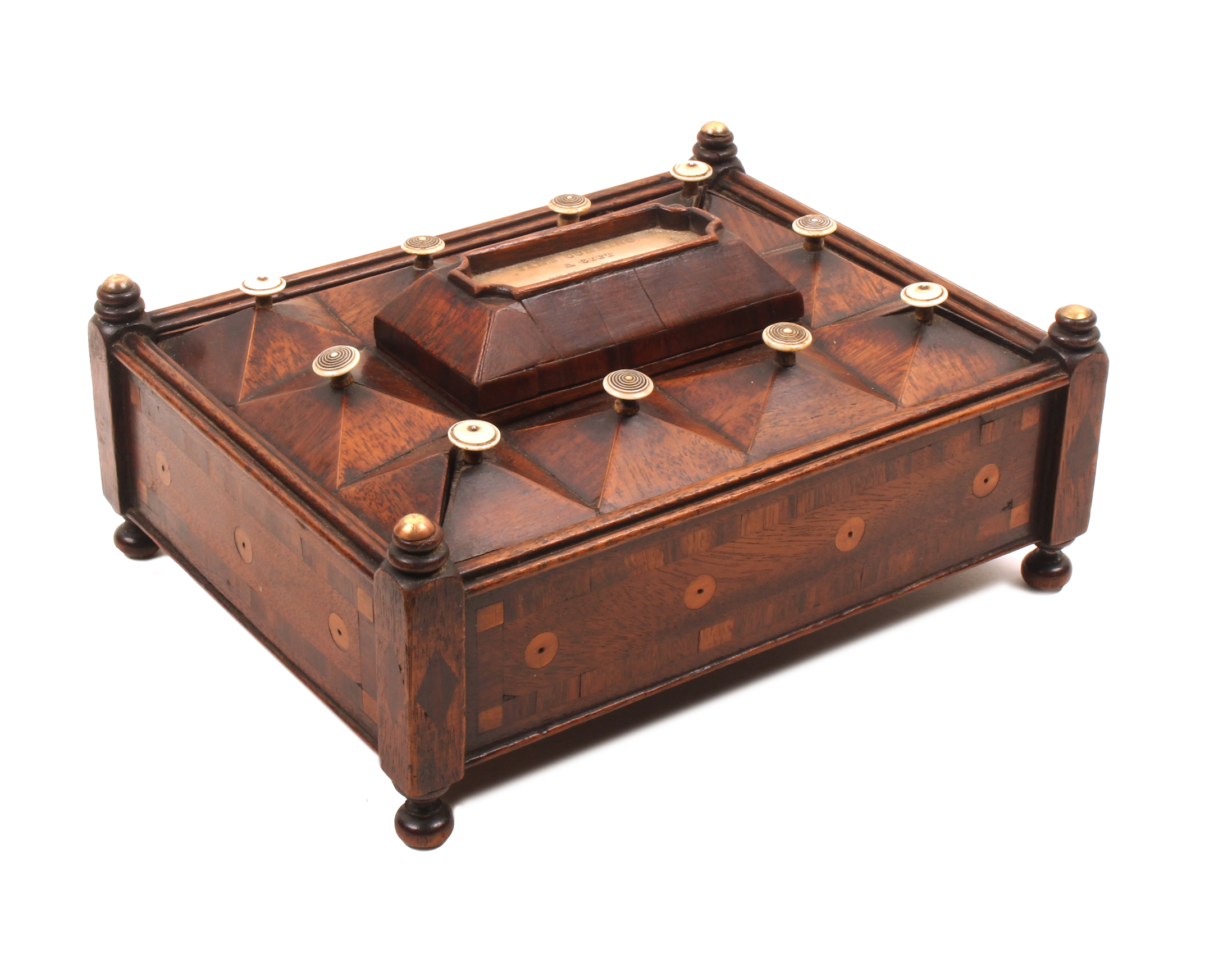 An unusual mahogany reel box dated 1839, of rectangular form raised on post from corners and ball
