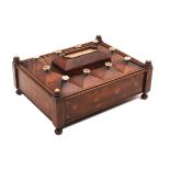 An unusual mahogany reel box dated 1839, of rectangular form raised on post from corners and ball