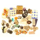 A collection of buttons including apple form and figural wooden, Ruskin style, metal owl heads,