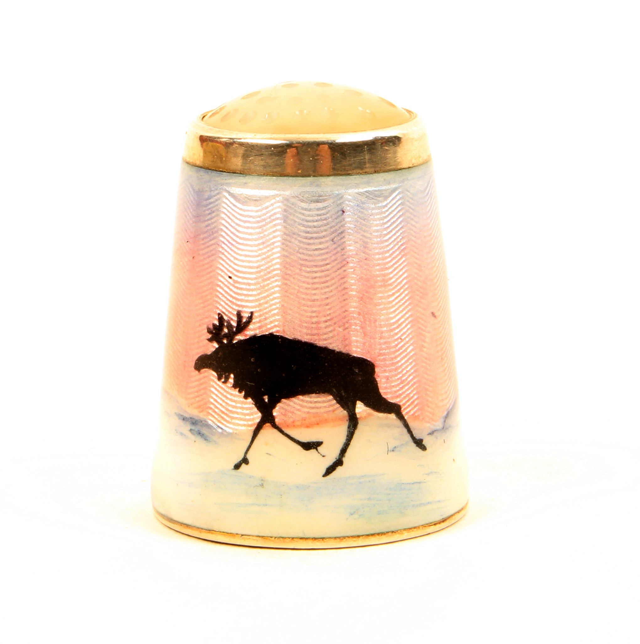 A Norwegian silver and enamel stone top thimble, by Aksel Holmsen, depicting a reindeer and trees in