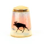 A Norwegian silver and enamel stone top thimble, by Aksel Holmsen, depicting a reindeer and trees in