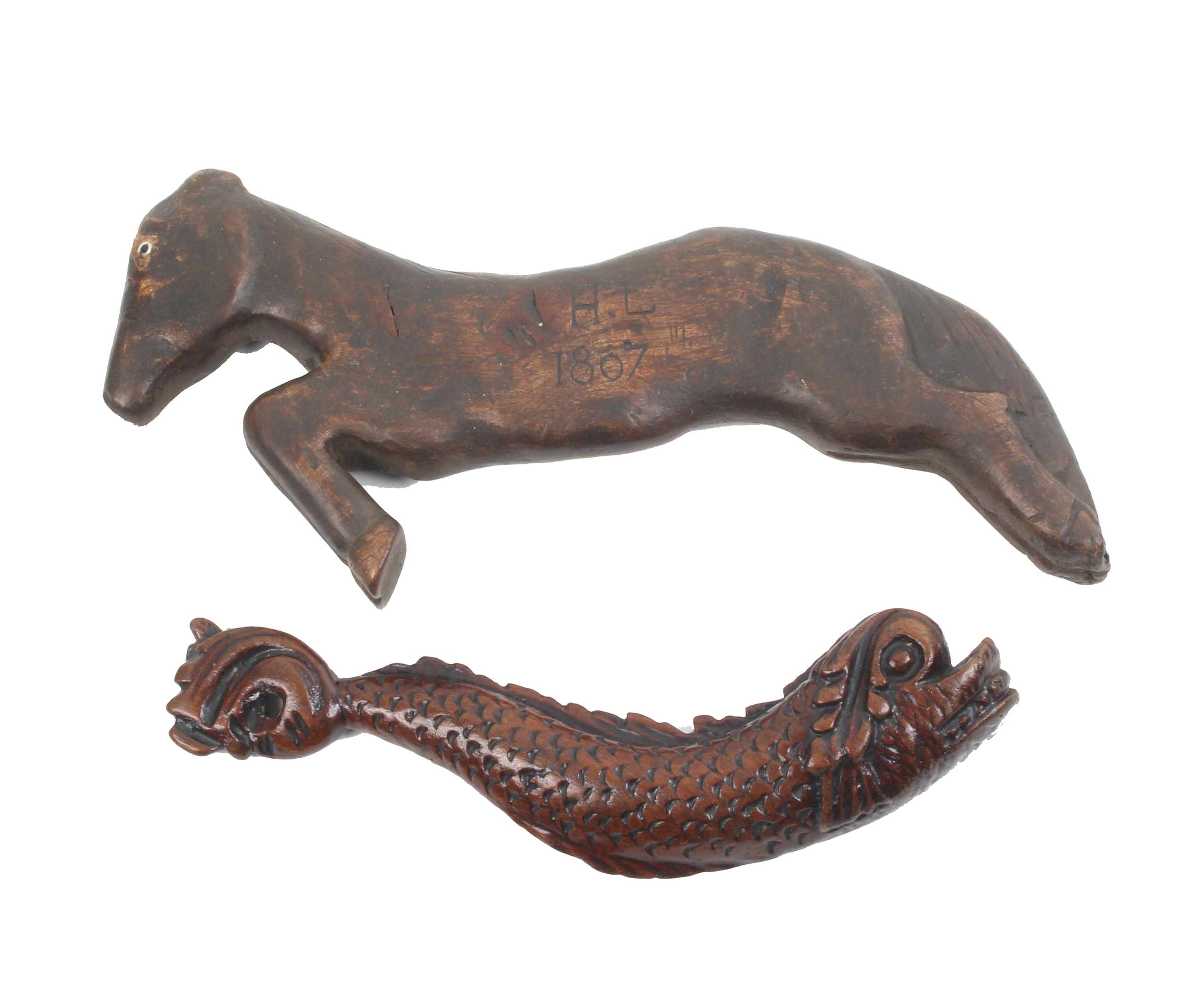 Two carved wooden figural knitting sticks, 19th Century comprising an example carved as a dolphin