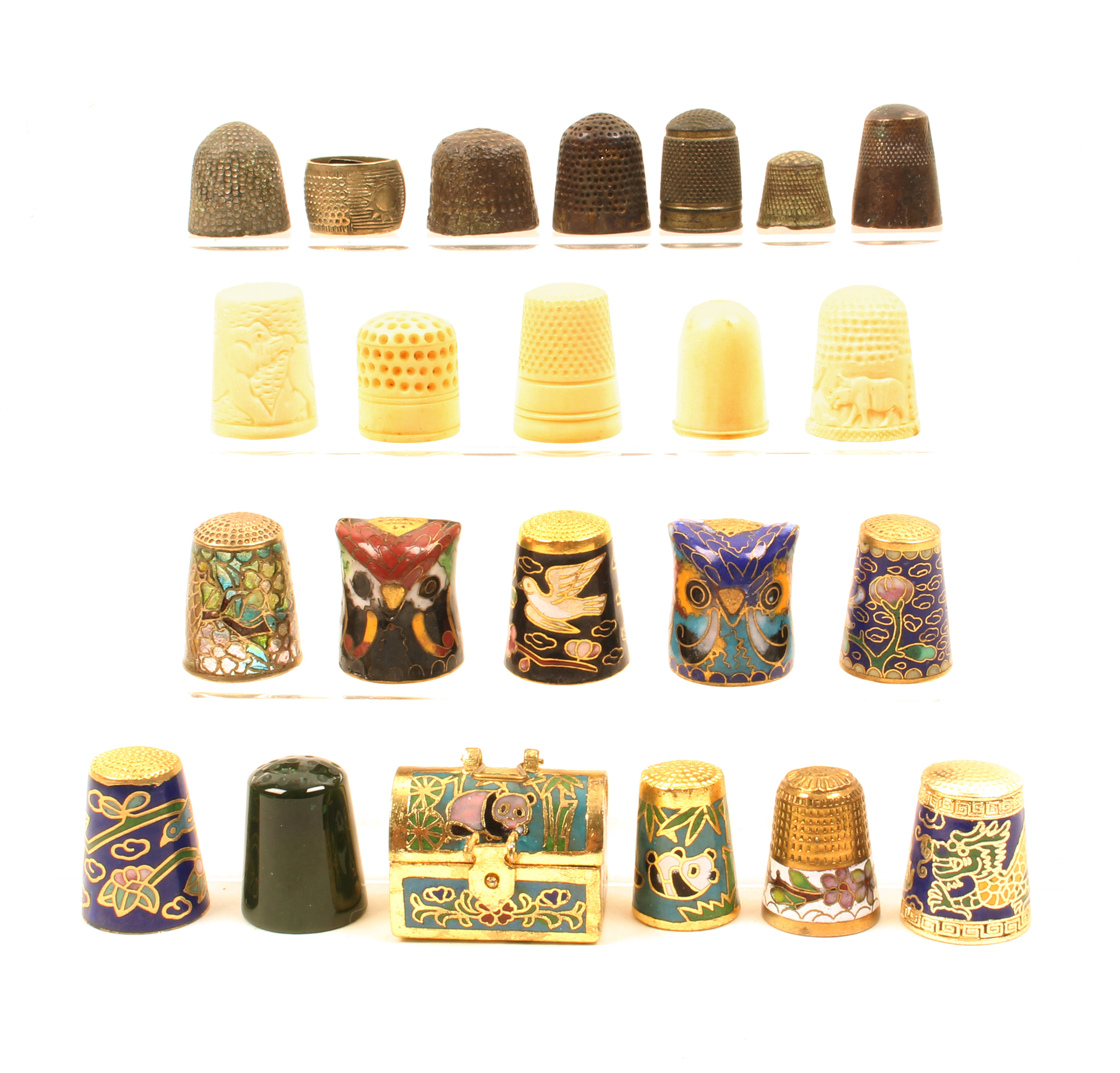 A mixed lot of thimbles, five in ivory, a jade example, six excavated metal examples, a ring, a