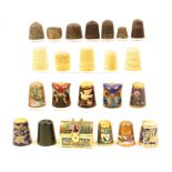 A mixed lot of thimbles, five in ivory, a jade example, six excavated metal examples, a ring, a