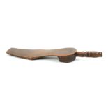 An attractive 19th Century stained beech knitting stick in the form of the sole of a shoe, the