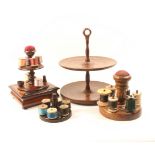 A 19th Century mahogany reel stand of two circular tiers with central pin cushion, the inlaid
