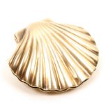 A 19th Century white metal silver gilt pin box in the form of a hinged scallop shell, the interior