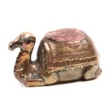 A rare silver pin cushion in the form of a camel at rest with decorative saddle cloth, stamped ‘