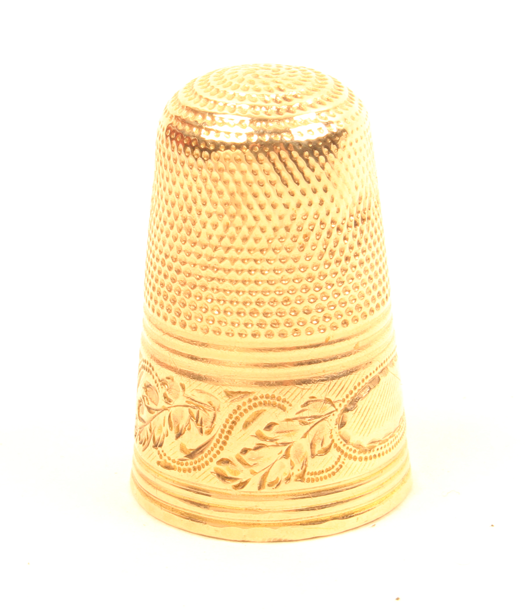 A 19th Century gold thimble of tall form, probably French, the leaf scroll frieze with vacant oval