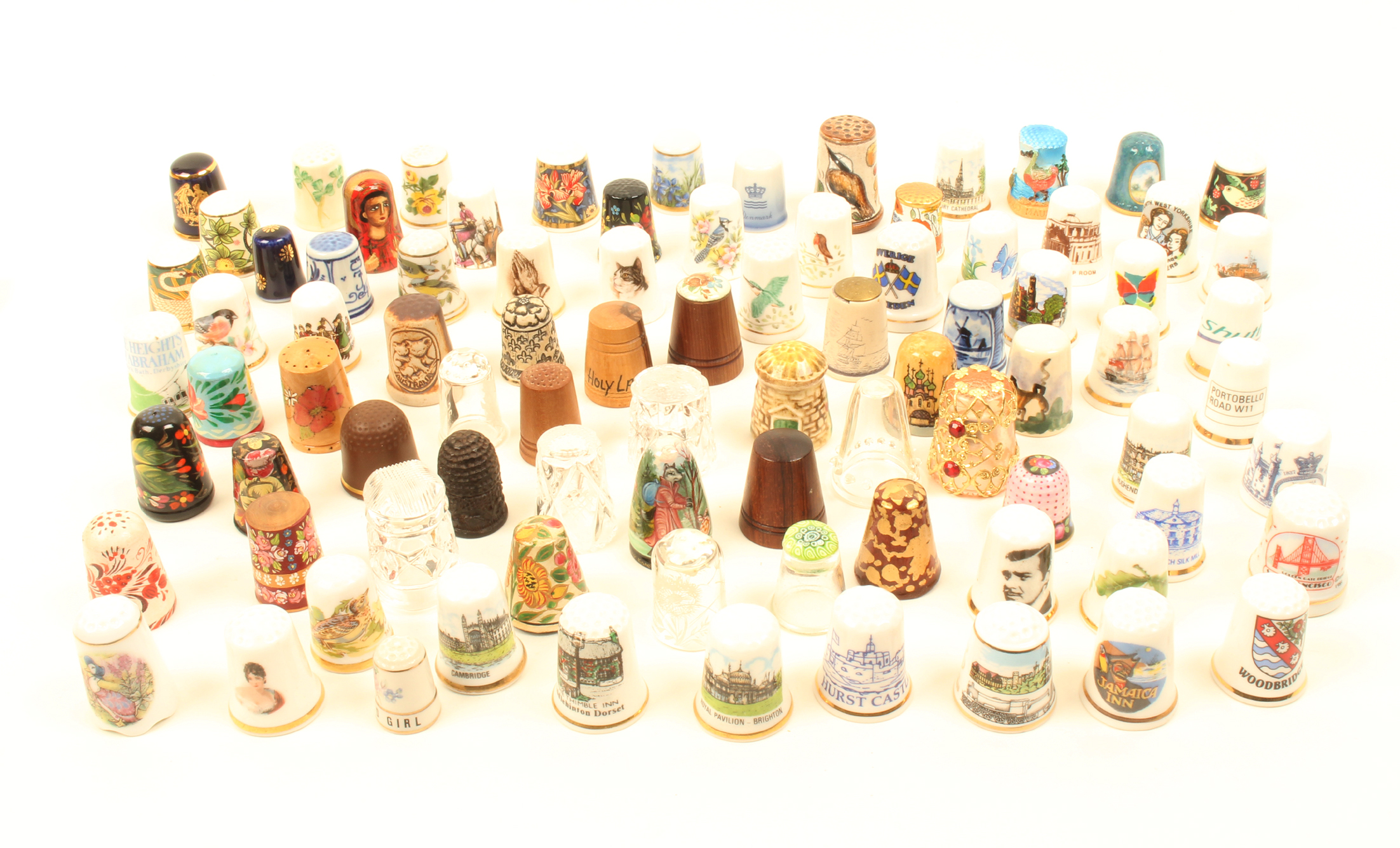 A collection of mostly modern thimbles, glass, ceramic, papier mache and wood. (80+)