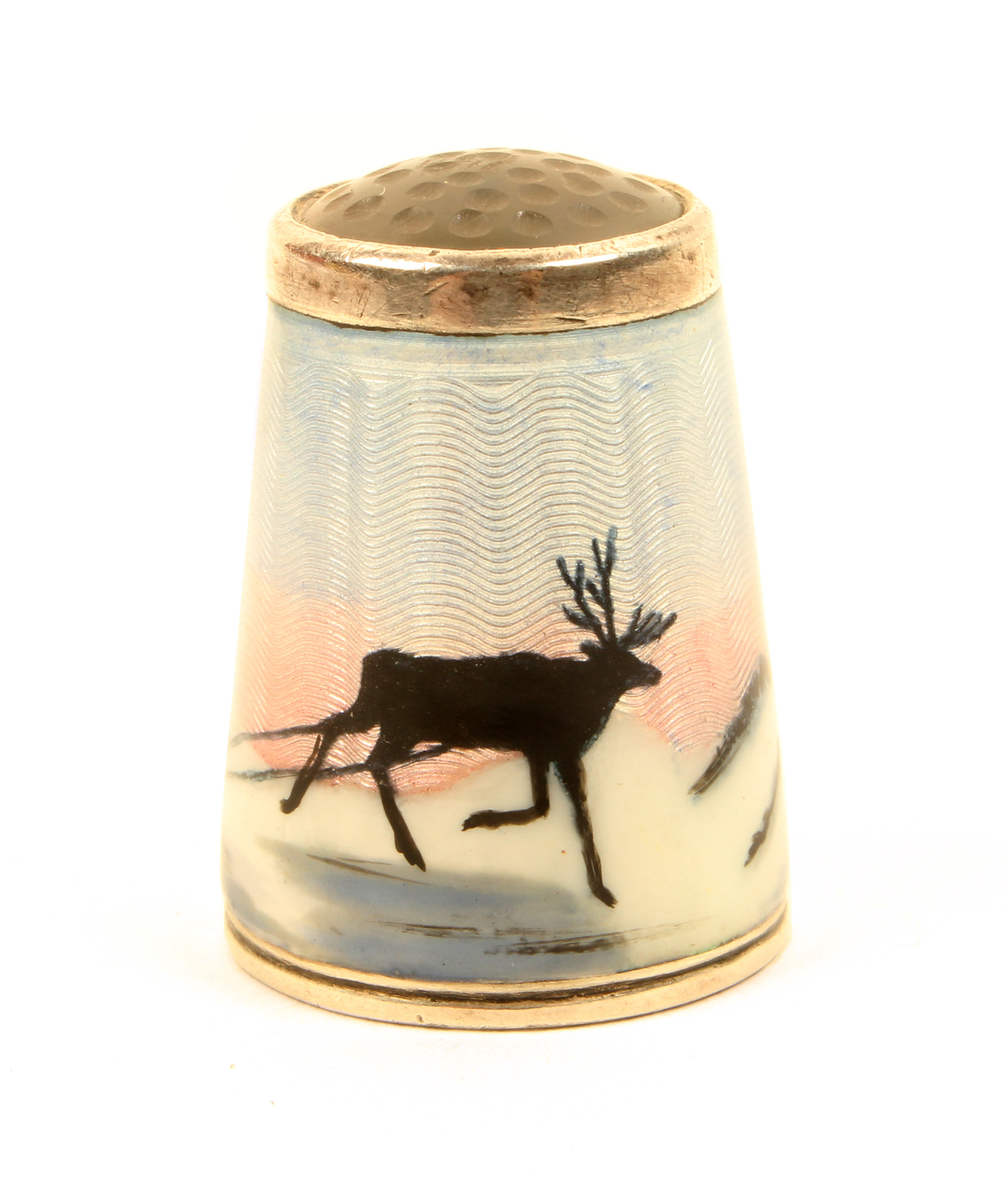 A Norwegian silver and enamel stone top thimble by Alex Holmsen, with a frieze of a Sami in a sled