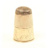 A tall English steel top silver thimble, the frieze engraved with stiff leaves and initialled ‘AK’.