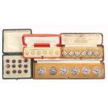 Four cased sets of buttons comprising a set of six Art Nouveau style floral examples, Chester