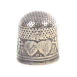 An English silver thimble early 18th Century, the circular indentations extending over the sides