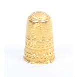 A gold thimble, the frieze with three decorative bands, general wear (From the collection of the