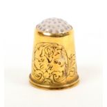 A Swedish gold thimble, the plain body with leaf scroll engraving over a reeded rim below a