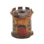 An early 19th Century painted Tunbridge ware circular cottage form box, painted with red panelled