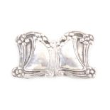 An Art Nouveau silver two piece buckle each of shaped form with a border of tendrils, London,