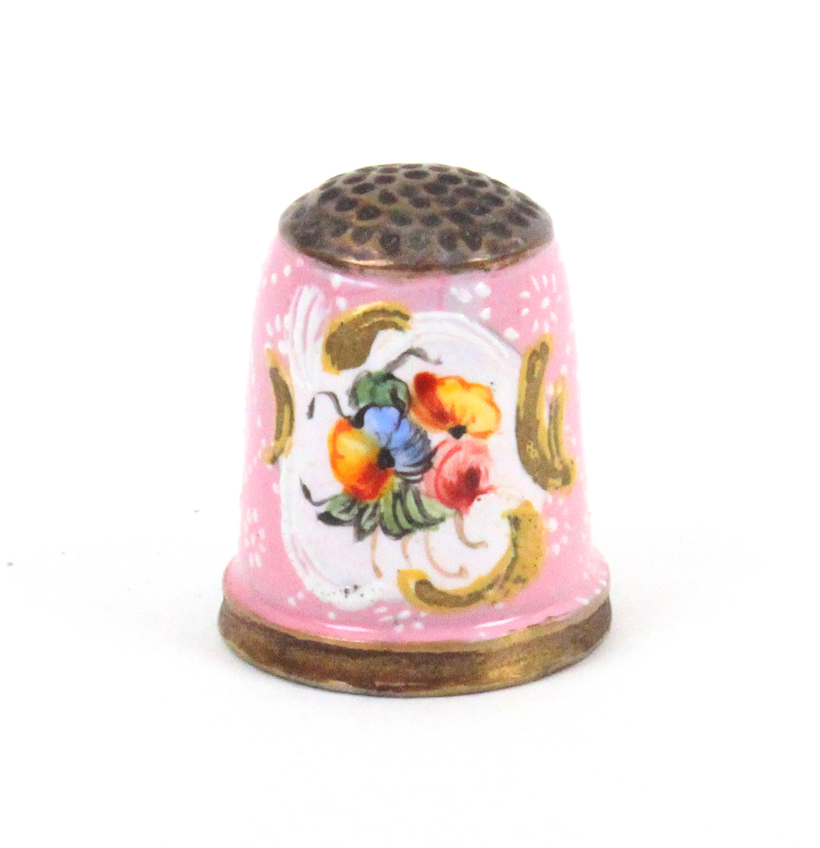 An 18th Century South Staffordshire enamel thimble, the pink ground with two white recessed panels