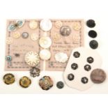A collection of thirty two buttons comprising a pearl cameo button in cut steel rim, 2.6cm dia,