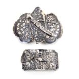 Two Russian niello silver belt buckles, the first in two parts of shaped form with script and leaf