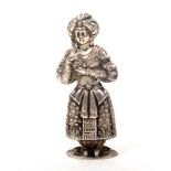 An early 19th Century silver figural needlecase in the form of a standing lady in turban and