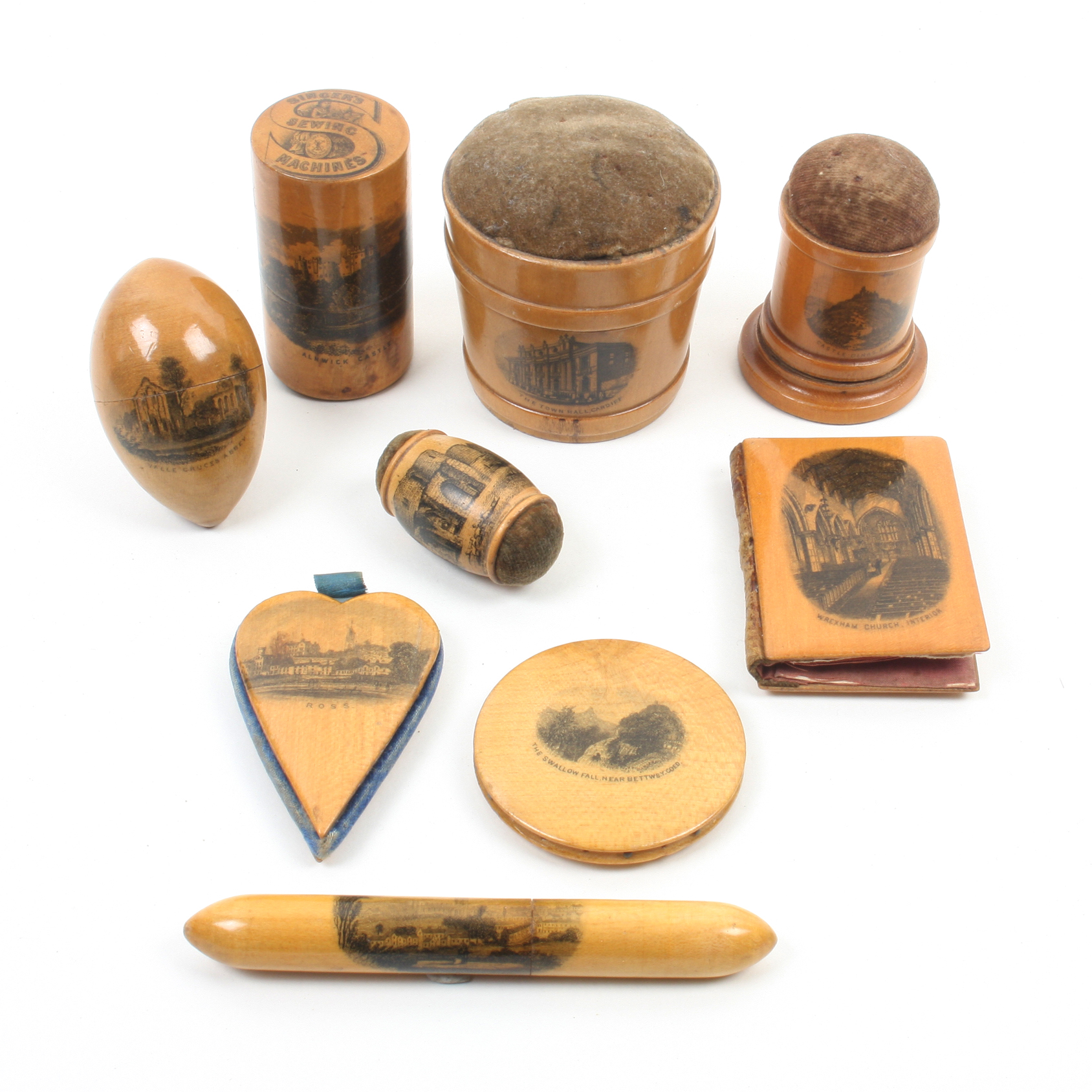 Mauchline ware _ sewing _ nine pieces comprising a Singer Sewing Machine cylinder needlecase (