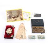 A group of needle books and related items comprising a plush needle book with metal mounts and