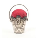 An early 19th Century silver basket form pin cushion by Joseph Taylor decorated with leaf sprays and