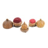 Three skep form painted Tunbridge sewing accessories comprising a tape measure on circular base