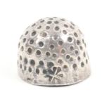 A 17th Century silver thimble with punched indentations, English provincial makers mark a quatre