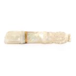 An early 19th Century Palais Royal carved mother of pearl needlecase in the form of a quiver of