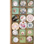 A collection of eighteen porcelain buttons late 19th Century and early 20th Century comprising