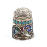 A Russian silver and cloissone enamel thimble with an upper border of turquoise dots over a broad