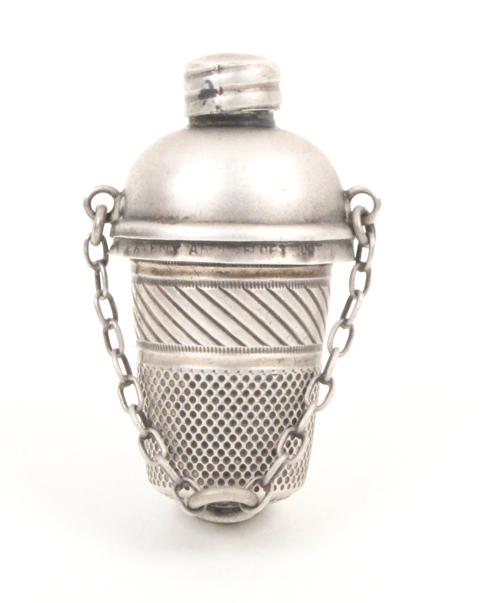 An unusual silver chatelaine thimble companion, the thimble with cross hatched frieze, gilded