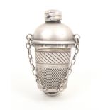 An unusual silver chatelaine thimble companion, the thimble with cross hatched frieze, gilded