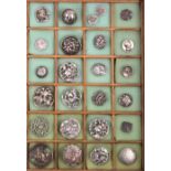 A collection of twenty five silver buttons mostly early 20th Century including flowers, birds,