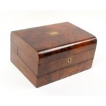 A Victorian combination sewing and writing box, in walnut, domed top with central brass plaque