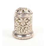 A 17th/18th Century silver thimble the body chased with leaf scrolls and flowers over an engraved
