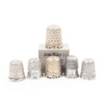 Six English silver thimbles with raised letter borders comprising Torquay, Blackpool, Lidgett