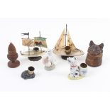 Seven thimble cases and stands comprising two in gilt metal, one mother of pearl as a sailing boats,