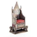 A silver pin cushion in the form of the coronation chair, Birmingham, 1901, by Levi and Salaman, 7.